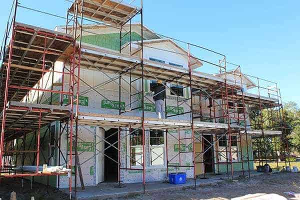 duplex surrounded by scaffolding