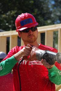 Staff member Chris using a reciprocating saw