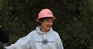 Woman in pink hard hat on site