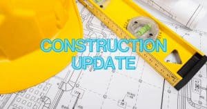 The words "Construction Update" written over image of architectural drawings, a hard hat and a level