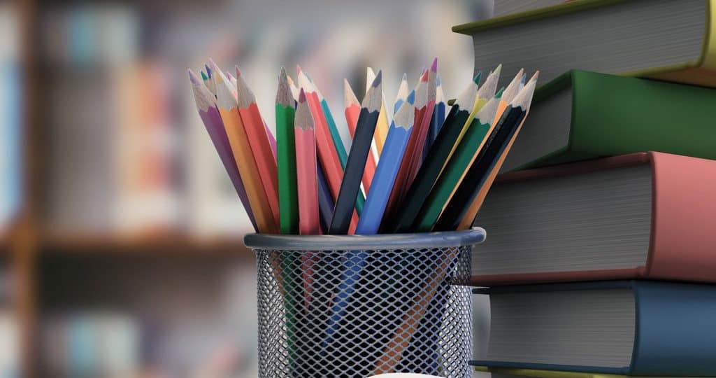 Composite image of school supplies on desk