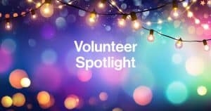 Volunteer Spotlight over Colorful Lights
