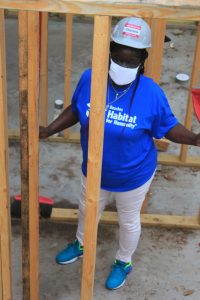 Beaches Habitat future homeowner, Charlene standing inside her home that is currently under construction. 