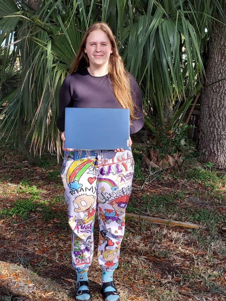 Young woman holding laptop