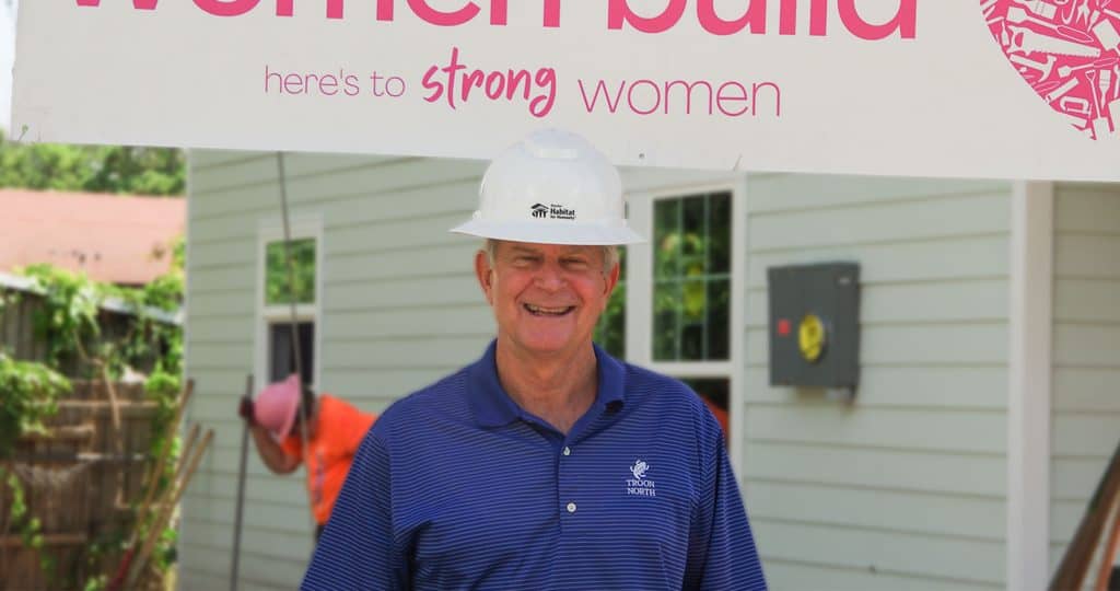 Man wearing white hard hat