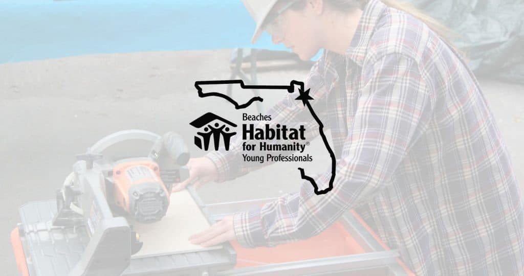 A Young Professional is using a tile saw to cut tile.