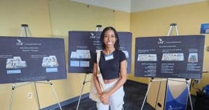 Young woman standing in front of UNF display boards