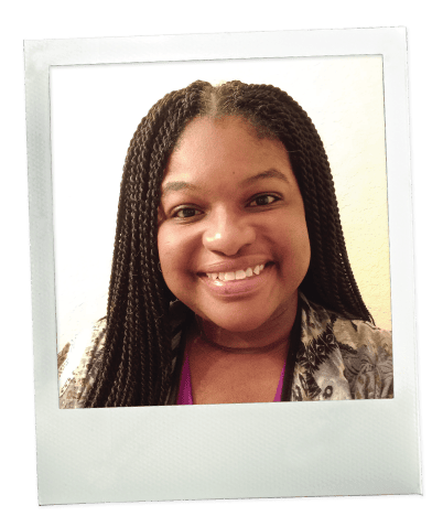 Ebony smiling in a close-up portrait, shown in a Polaroid-style frame.