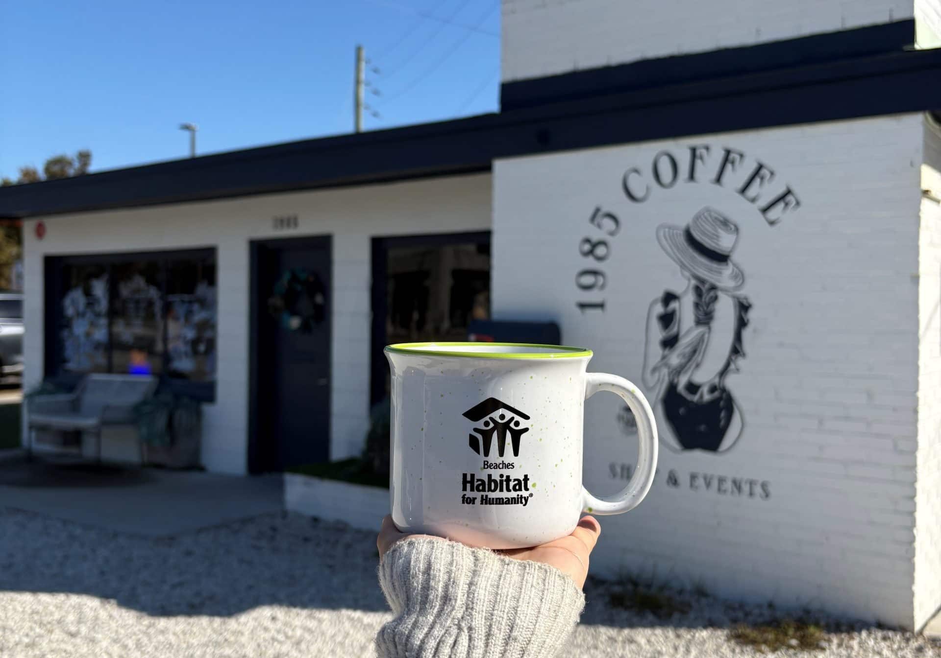 Beaches Habitat coffee mug held outside 1985 Coffee.