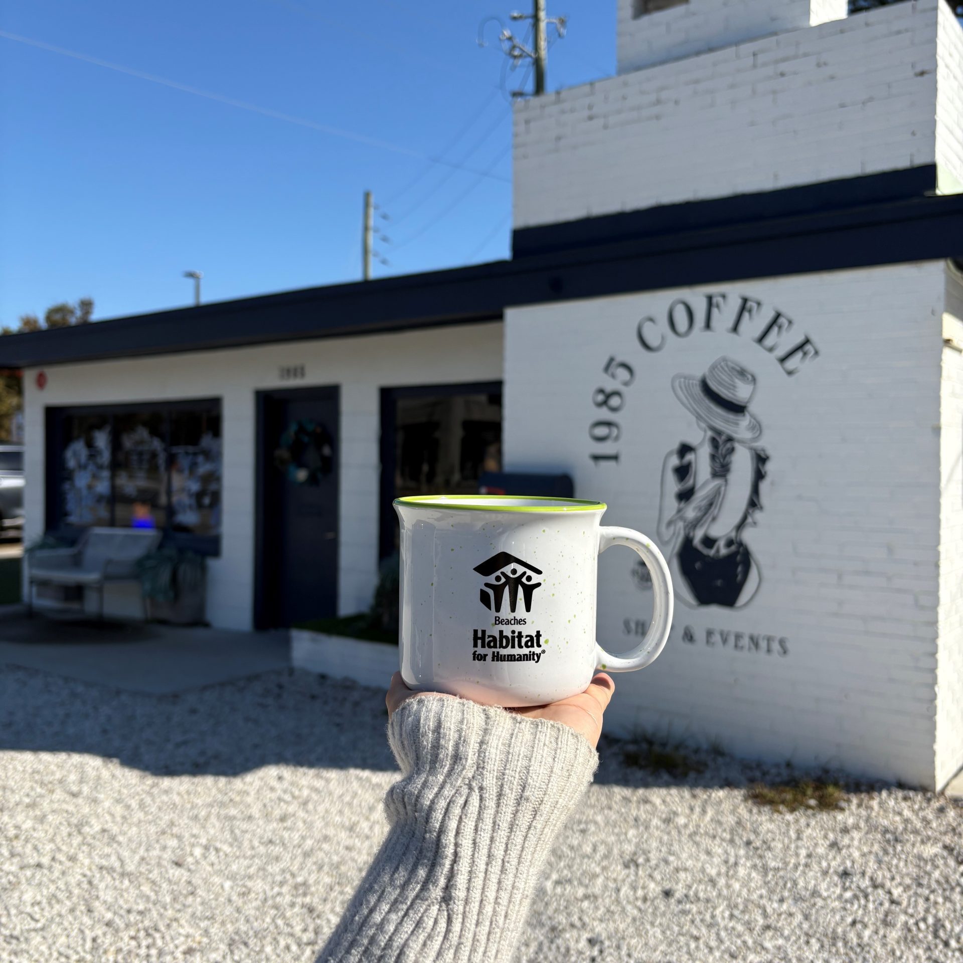 Beaches Habitat coffee mug held outside 1985 Coffee.